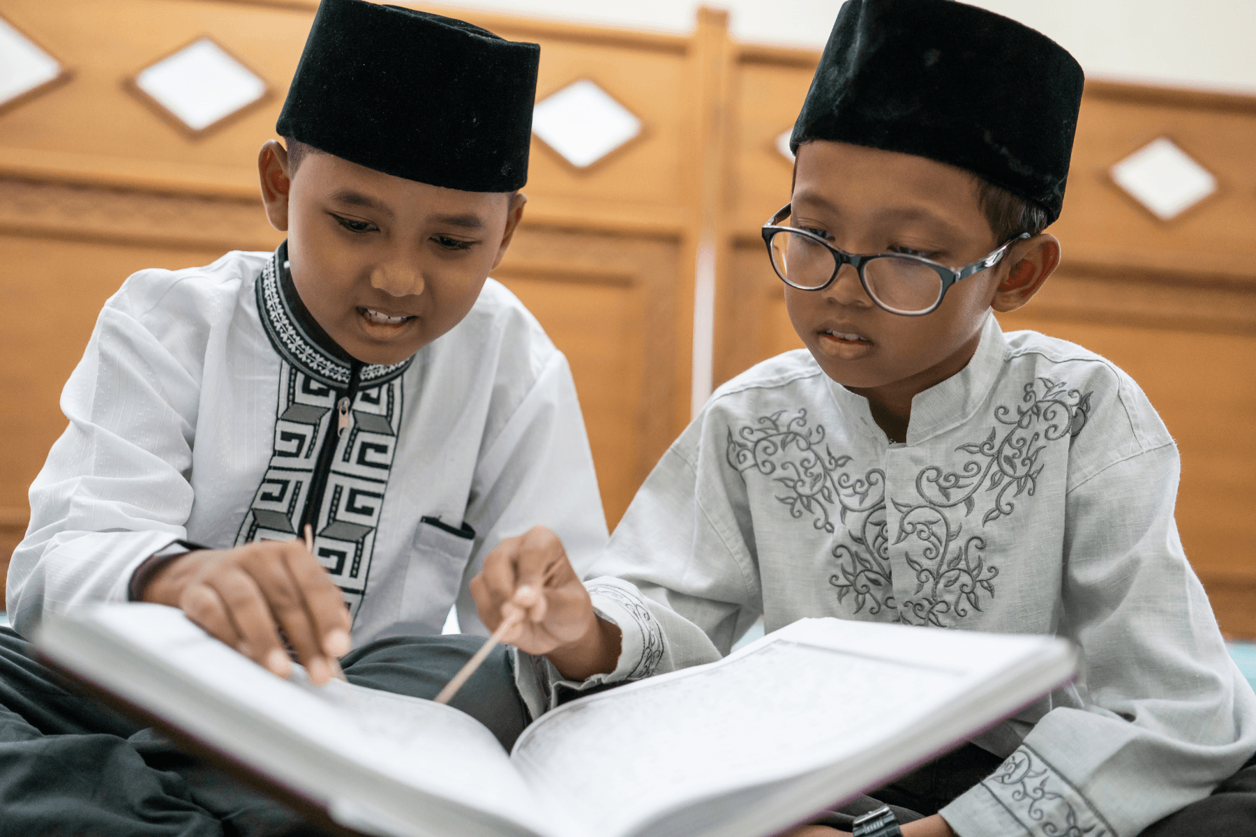An Australian family arranging an online Quran class at home after school