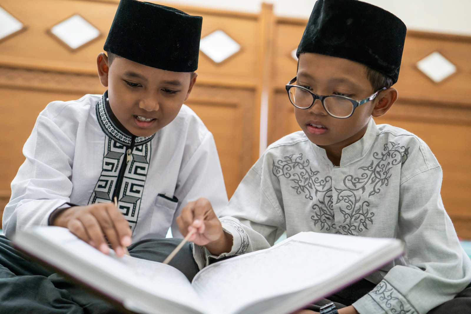 An Australian family arranging an online Quran class at home after school